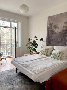 a bedroom with a bed and a large window at Apartment_Lucas in Hamburg