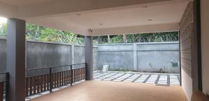 an internal courtyard of a house with a fence at Royal Residency in Plaine Magnien