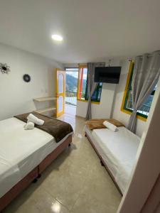 Postel nebo postele na pokoji v ubytování CASONA HOTEL LA DIVISA