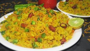 a plate of food with a rice dish with a lime at Tony's beach house in Calangute