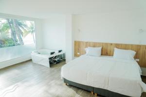 Postel nebo postele na pokoji v ubytování Hotel Caribbean Cartagena