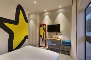 TV a/nebo společenská místnost v ubytování Cucu Hotel