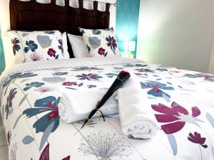 a bed with a blanket and a towel on it at Emporium Néris - Premium Serviced Apartments in Néris-les-Bains