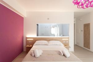 Postel nebo postele na pokoji v ubytování Glorian Hotel