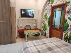 Телевизор и/или развлекательный центр в Ta' Marija Home