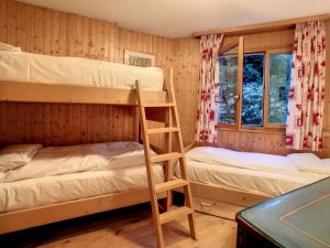 a room with two bunk beds and a ladder at Appartement Andrea in Verbier
