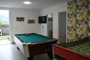 a room with two pool tables in a room at O Monteiriño in Arbo