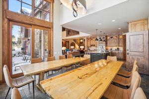 a dining room with wooden tables and chairs at Trot Ski-House in Breckenridge