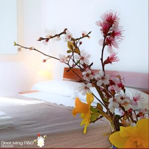 Postel nebo postele na pokoji v ubytování BeeLiving Room&Breakfast