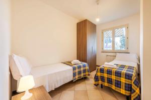 Postel nebo postele na pokoji v ubytování Casa Vacanze Vignarca - Località Perelli