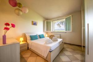 Postel nebo postele na pokoji v ubytování Casa Vacanze Vignarca - Località Perelli