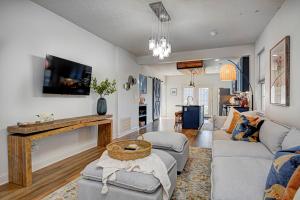 a living room with a couch and a fireplace at Spacious Bates-Hendricks Home ~ 5 Min to Lucas Oil in Indianapolis