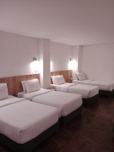 Postel nebo postele na pokoji v ubytování Hotel Caribbean Cartagena