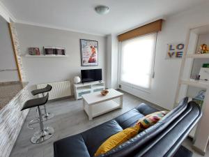 TV a/nebo společenská místnost v ubytování Casa Riquiña