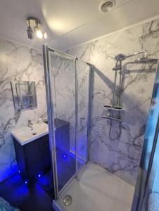 a bathroom with a shower and a sink at The Croft, North Staffordshire in Blythebridge