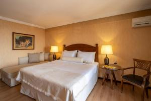 Postel nebo postele na pokoji v ubytování Likoria Hotel