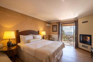 Postel nebo postele na pokoji v ubytování Likoria Hotel