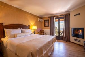 Postel nebo postele na pokoji v ubytování Likoria Hotel