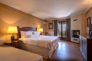 Postel nebo postele na pokoji v ubytování Likoria Hotel