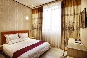 TV a/nebo společenská místnost v ubytování Igiban Hotel