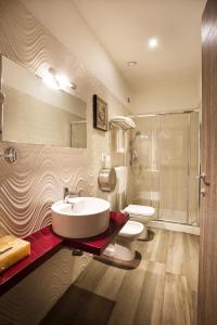 Koupelna v ubytování Igiban Hotel
