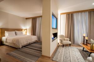 A bed or beds in a room at Likoria Hotel