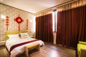 Ένα ή περισσότερα κρεβάτια σε δωμάτιο στο Igiban Hotel
