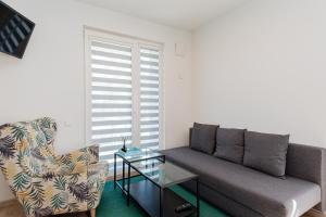 Χώρος καθιστικού στο PRIVATE APARTMENT WITH TERRACE AND SWIMMING POOL