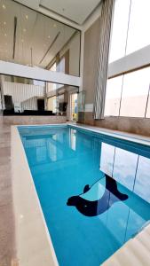 Πισίνα στο ή κοντά στο Al-Mona Resort شاليه المنى الخبر