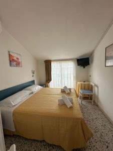 Postel nebo postele na pokoji v ubytování Hotel Till