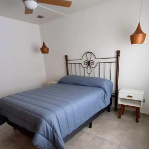 En eller flere senge i et værelse på COMPLEJO PATAGONIA AZUL