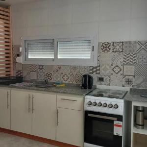 Køkken eller tekøkken på COMPLEJO PATAGONIA AZUL