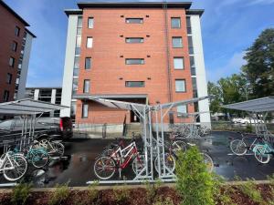 a group of bikes parked in front of a building at Docent's Flat in Joensuu