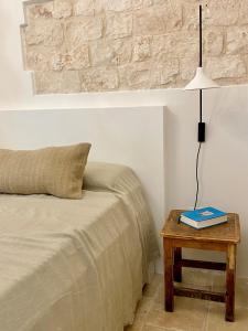 A bed or beds in a room at Trullo Falco
