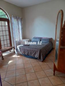 a bedroom with a bed with the words room at 999 Pretorius street in Pretoria