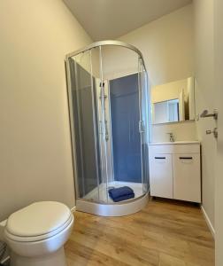 a bathroom with a shower with a toilet and a sink at Station 173 B Bruxelles-Charleroi-airport in Charleroi