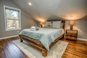 a bedroom with a bed and a window at Pisgah Hillside Haven in Pisgah Forest