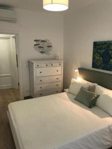 Ένα ή περισσότερα κρεβάτια σε δωμάτιο στο PISI HOME, 2 min dalla spiaggia e dall' Ospedale Gaslini