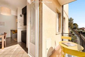 a room with a balcony with a table and a window at La Tana del Polpo in Monterosso al Mare