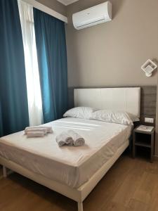 Voodi või voodid majutusasutuse Sunset Guest House toas