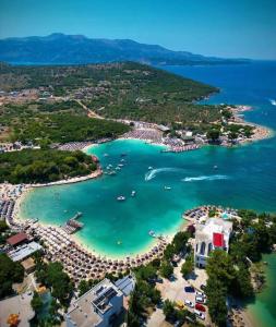 an aerial view of a beach with boats in the water at Guest House Bledar in Ksamil