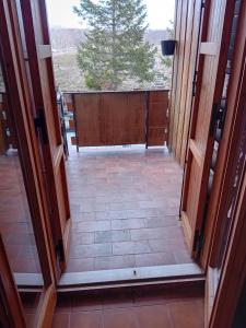 a view from the inside of a door of a porch at Monolocale campo d'altura in Rieti