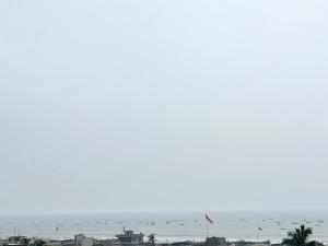 a view of the ocean from the roof of a building at Hotel A ONE pride ! Puri fully-air-conditioned-hotel near-sea-beach-&-temple with-lift-and-parking-facility restaurant-availability in Puri