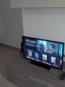 A television and/or entertainment centre at St Julians Sliema 3 minutes walk from promenade 3 bedroom apartment
