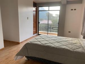 Postel nebo postele na pokoji v ubytování Casa Hospedaje El Trebol