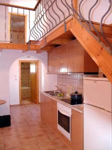 a kitchen with a sink and a stove top oven at LAKIS APPARTMENTS in Faliraki