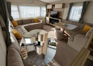 an aerial view of a living room and kitchen in a caravan at 134 HOLIDAY RESORT UNITY BREAN PASSES INCLUDED Pets stay free Max 2 pets in Brean