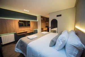 Postel nebo postele na pokoji v ubytování Pinot Hotel