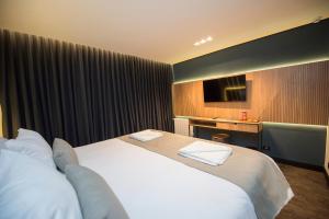 Postel nebo postele na pokoji v ubytování Pinot Hotel