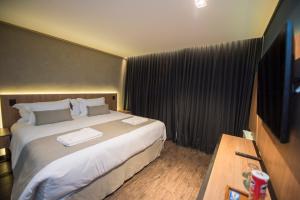 Postel nebo postele na pokoji v ubytování Pinot Hotel